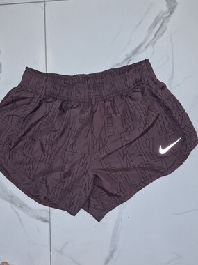 Nike Women's Burgundy Athletic Shorts with Reflective Swoosh
